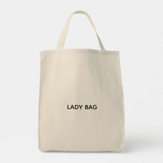 Un sac fourre-tout beige avec le texte "LADY BAG" 