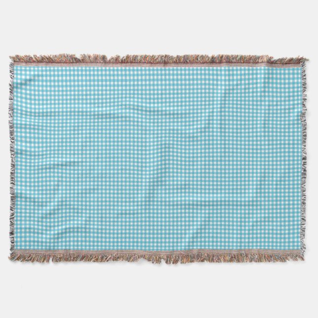 Une couverture à carreaux bleu clair et blanc  (Devant)
