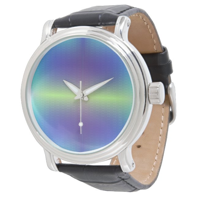 Une montre avec un visage rond métallique  (Incliné)