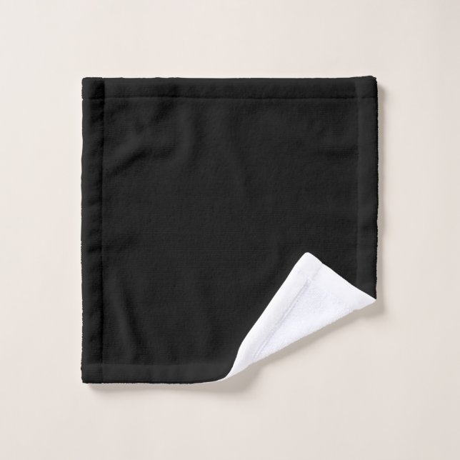 Une surface noire texturée avec un motif de grain  (Gant de toilette)
