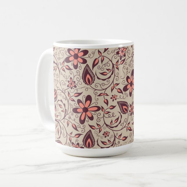 Une tasse en céramique avec un fond beige  (Devant gauche)