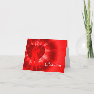 Valentine embrassant la carte rouge de lueur de