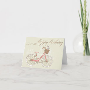 Vélo rose avec la carte d'anniversaire Terrier