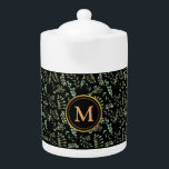 vert botanique feuille motif théière noire<br><div class="desc">La théière présente un design captivant, avec des feuilles botaniques verdoyants, étroitement imbriqués sur un arrière - plan noir élégant, créant une ambiance harmonieuse et rafraîchissante. Pour ajouter une touche de personnalisation, nous avons orné la théière d'un luxueux monogramme d'or, affichant élégamment vos initiales ou votre nom. Conçu avec soin,...</div>