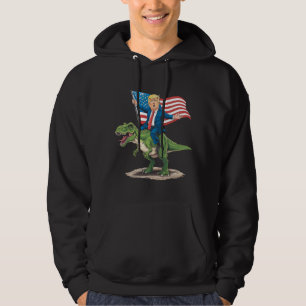 Veste À Capuche Trump à cheval sur un dinosaure T Rex drapeau amér