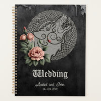 Viking Wolf & Rose. Une tête de loup stylisée,