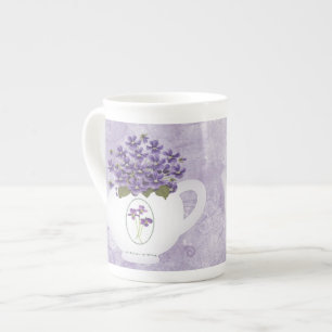 Violettes Dans La Mug De Chine Os De Théâtre