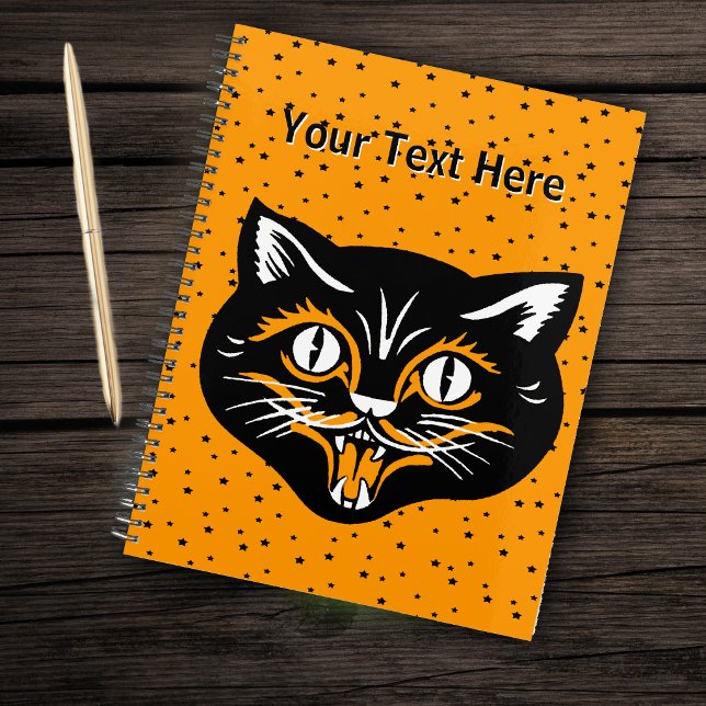 Visage de chat noir heureux Halloween Vintage étoi (Happy black cat vintage Halloween face on tiny black stars on orange planner.)
