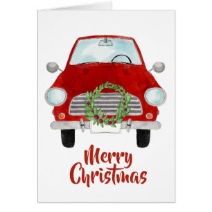 Voiture rouge avec couronne de Noël