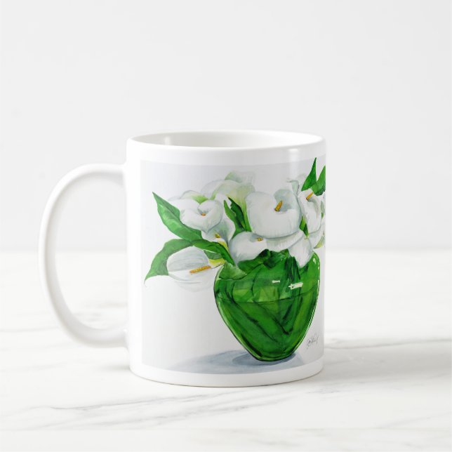 Zantedeschias dans la tasse verte de vase (Gauche)